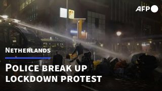 Dutch police use water cannon on Covid protesters | AFP